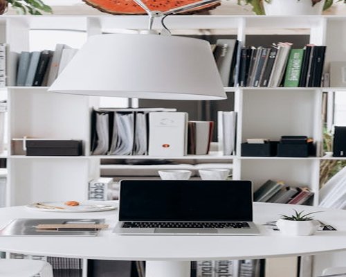 Organized modern workspace with laptop and natural light